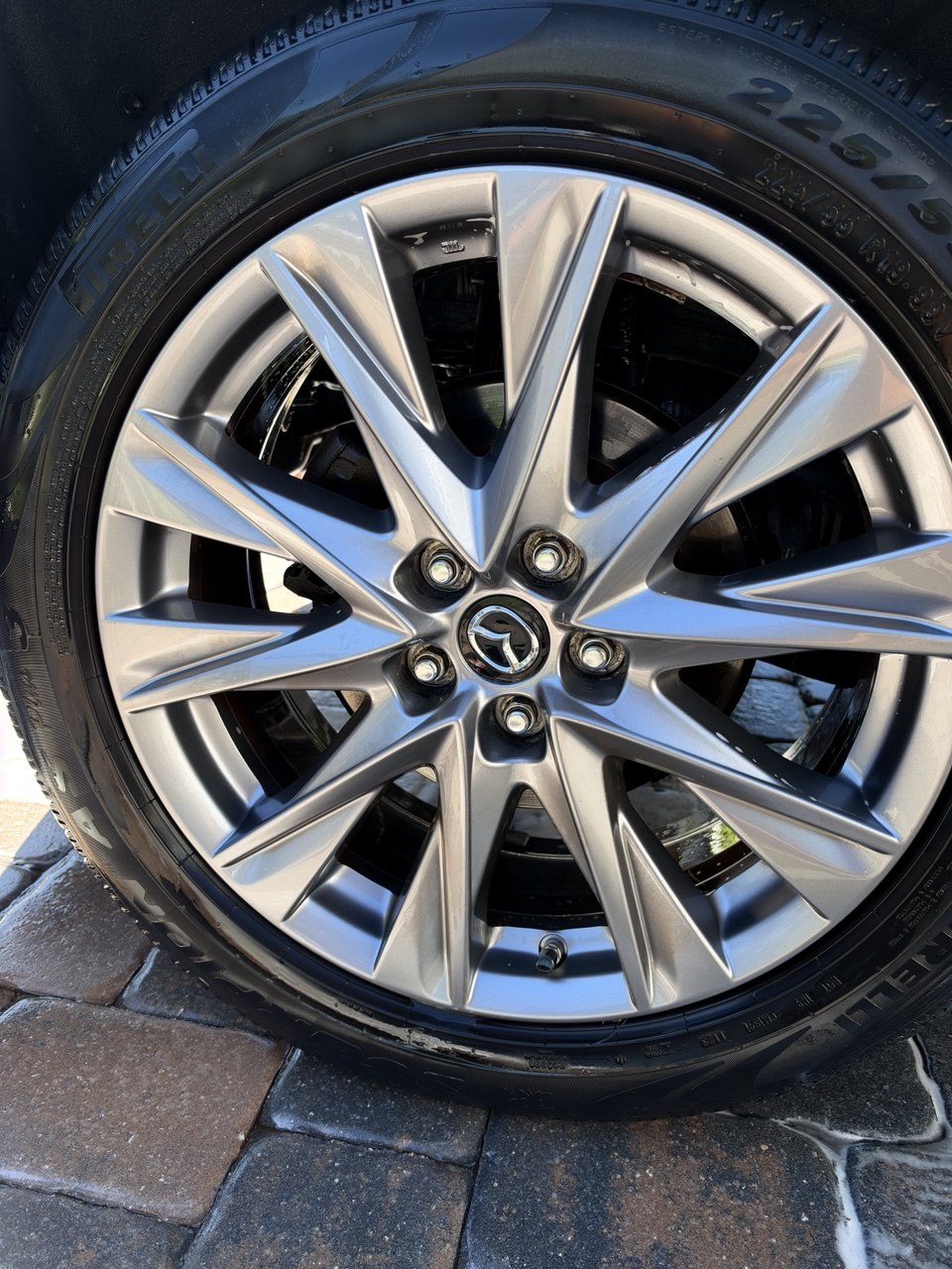 Mazda wheel fully cleaned and dressed after Rigger detailing